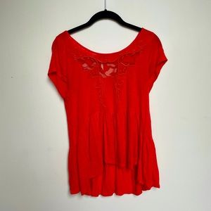 Free people orange/ peach top with cut out design